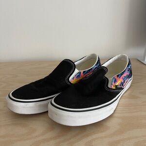 VANS black slip ons with glow in the dark lighting bolts